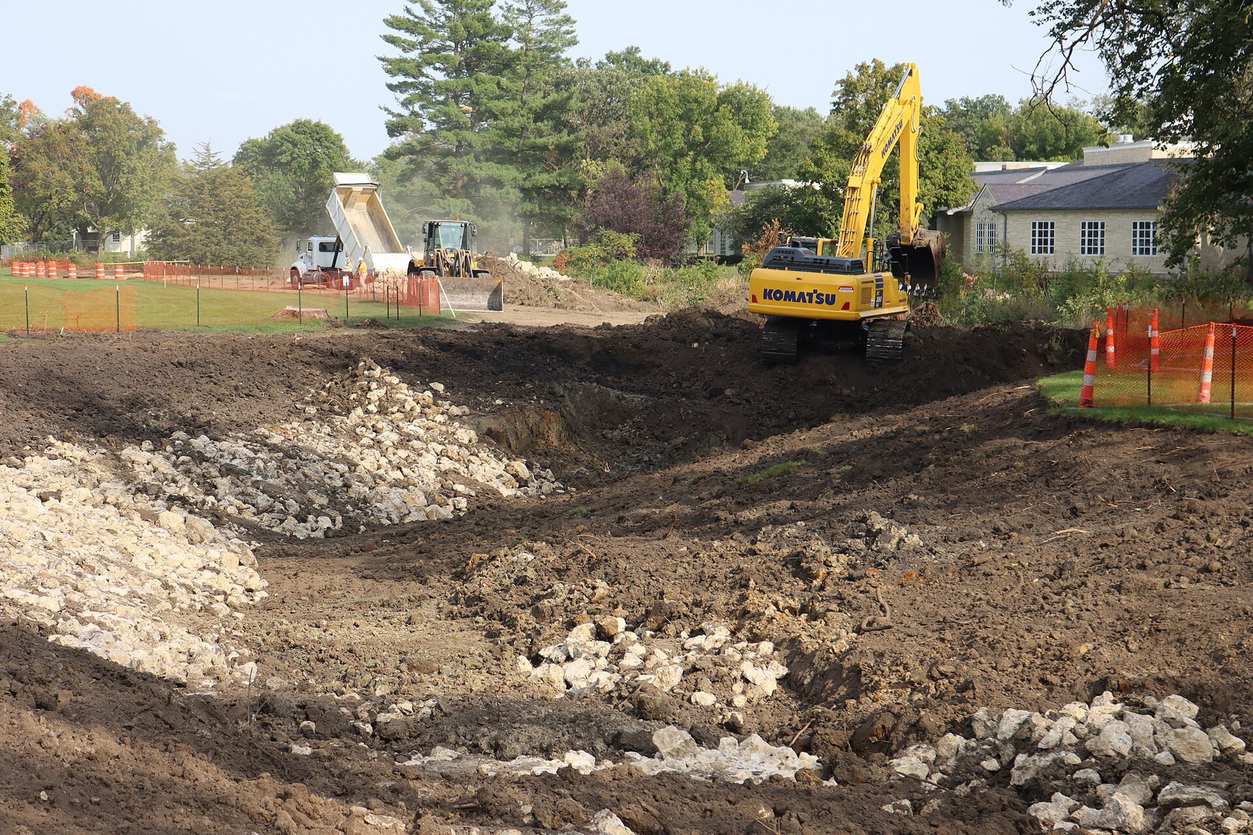 Excavator working on a cleared building site