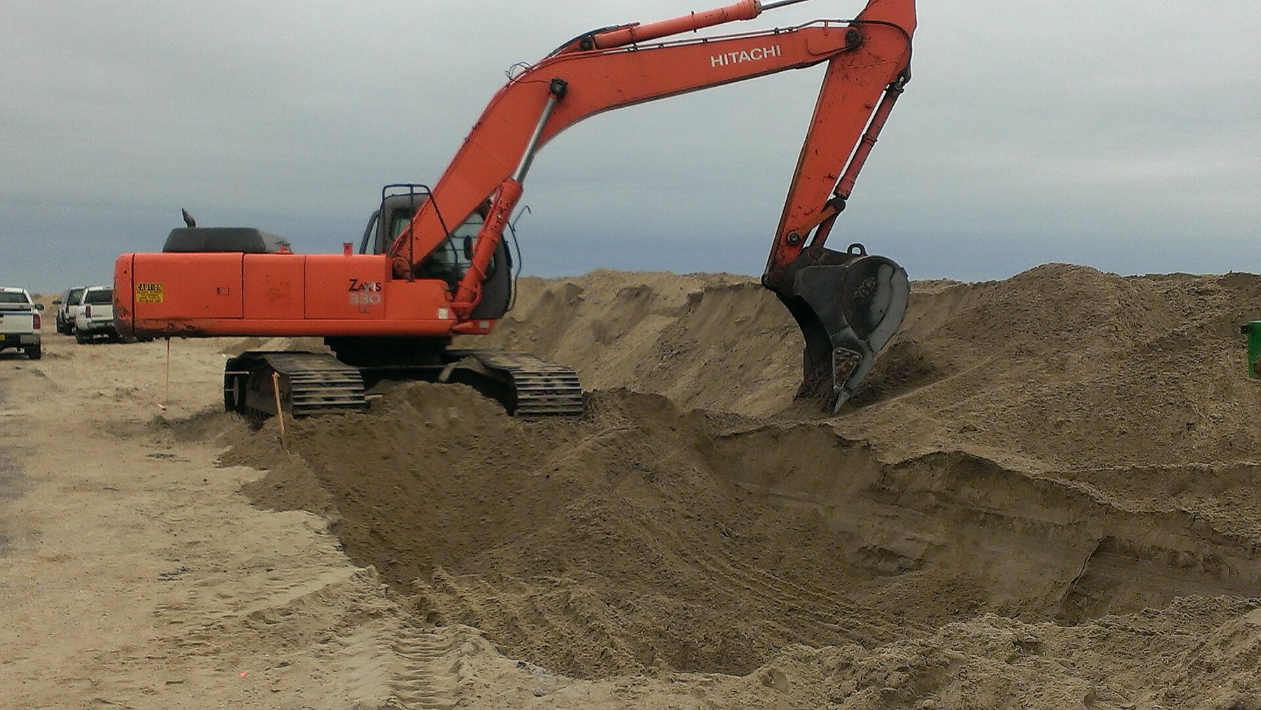 Excavator digging a trench