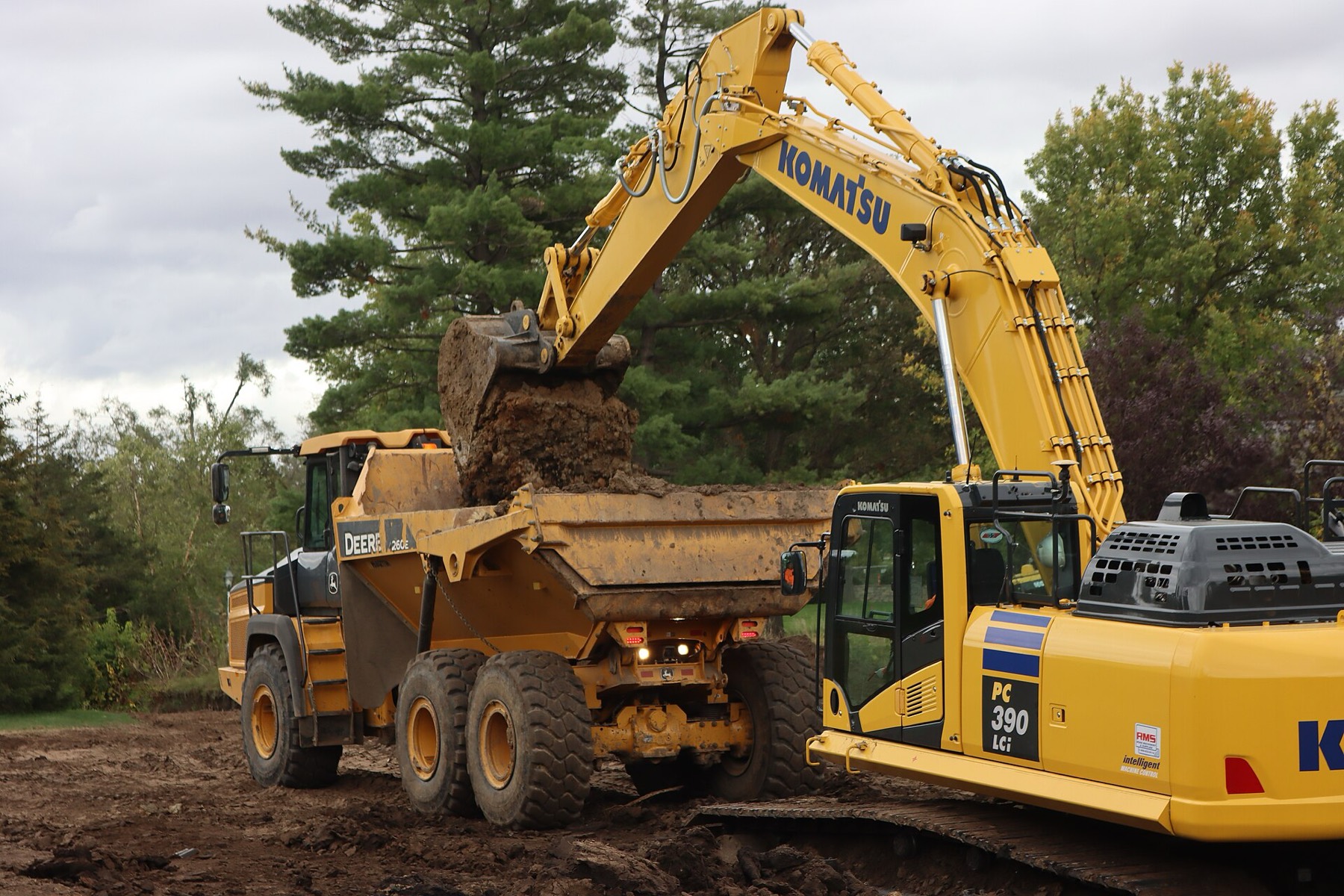Excavator loading a dump truck